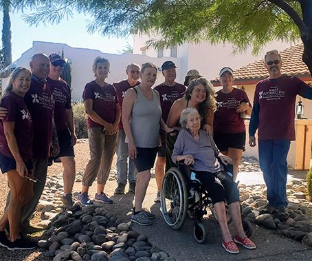 volunteers helping older citizen. Group photo
