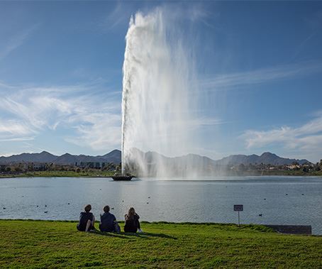 People sitting on the lawn at Fountain Park