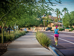 woman jogging in bike lane 300
