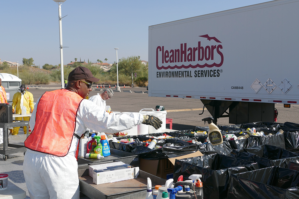Household Hazardous Waste Day worker putting items into boxes for transport
